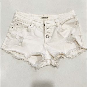 White denim billabong shorts
